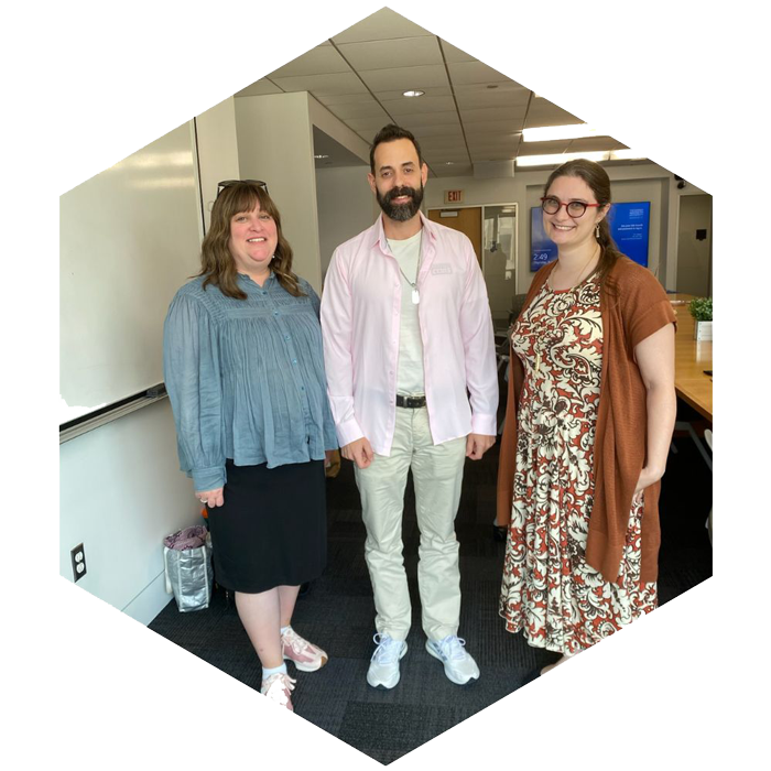 Three CASJE Applied Research Fellows stand together to pose for photo (image is hexagon shaped)
