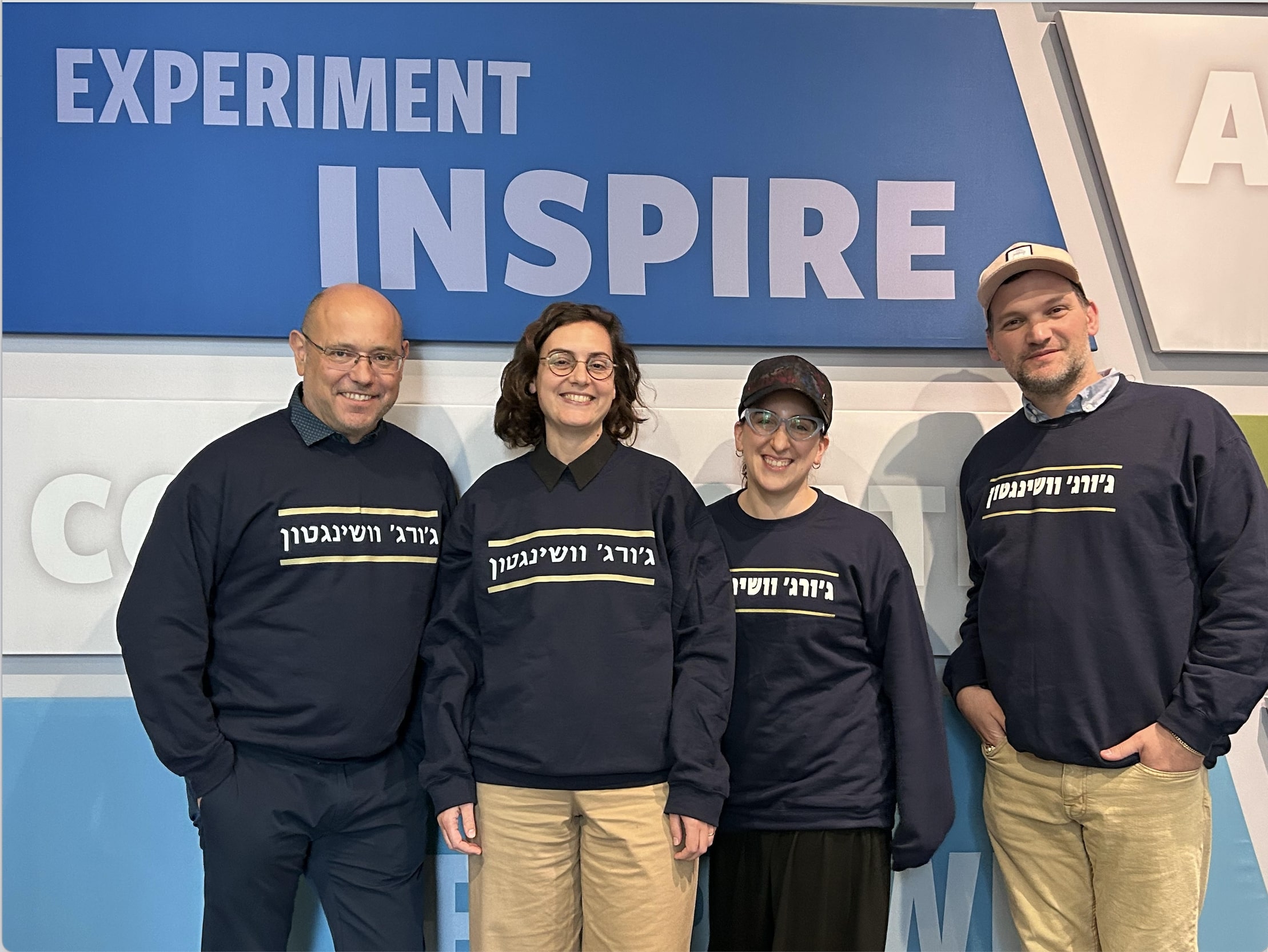 CASJE Applied Research Fellows in front of poster "Experiment Inspire"