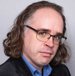 Man with glasses in collared shirt
