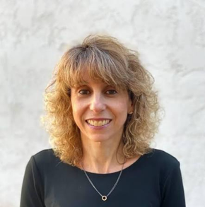 Headshot of woman with blond hair and black shirt