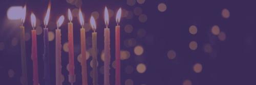 Menorah under purple background with lights