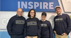 CASJE Applied Research Fellows in front of poster "Experiment Inspire"